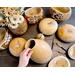This shows several unfinished gourds along side some gourds made into decorative vases.